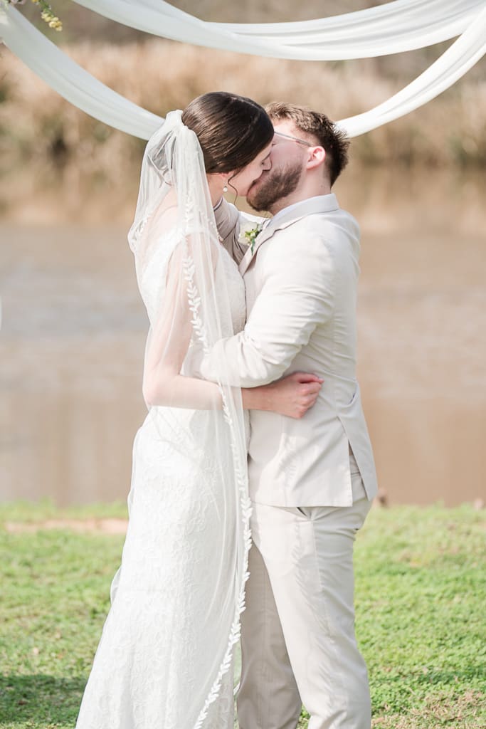 Groom kissing bride at South Louisiana Wedding