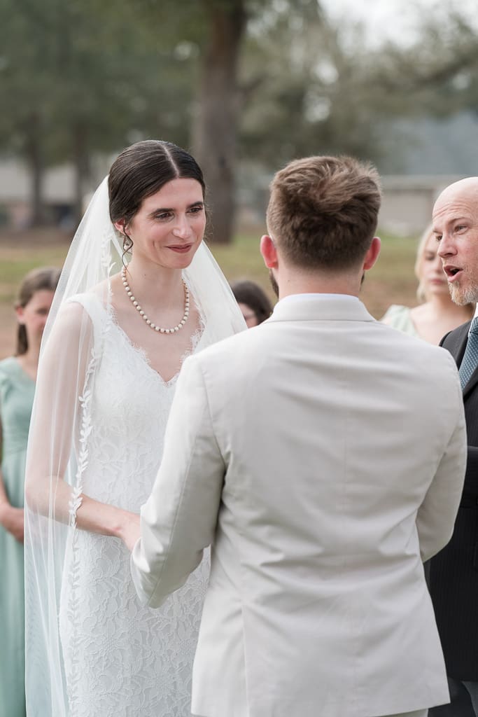 Bride saying vows at South Louisiana Wedding, Photographer