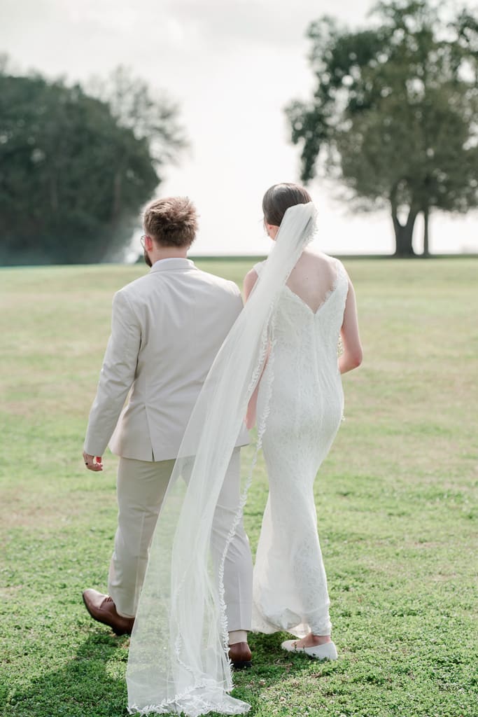 Bride and groom walking away after just being married, South Louisiana Wedding photographer