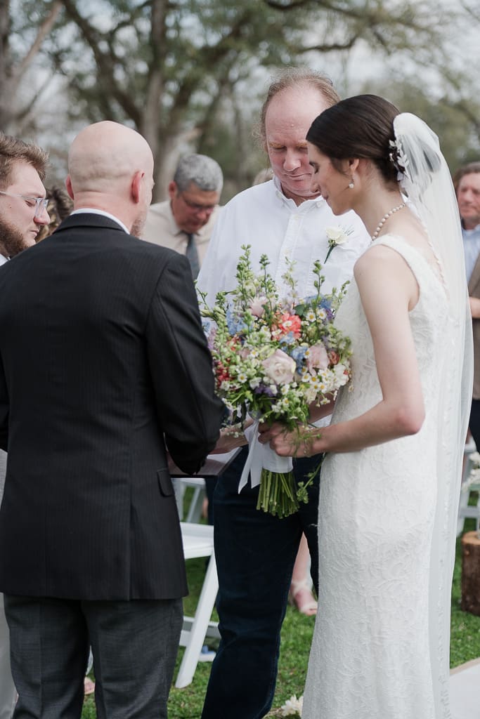 Father handing over Bride to Groom at altar by South Louisiana Wedding Photographer