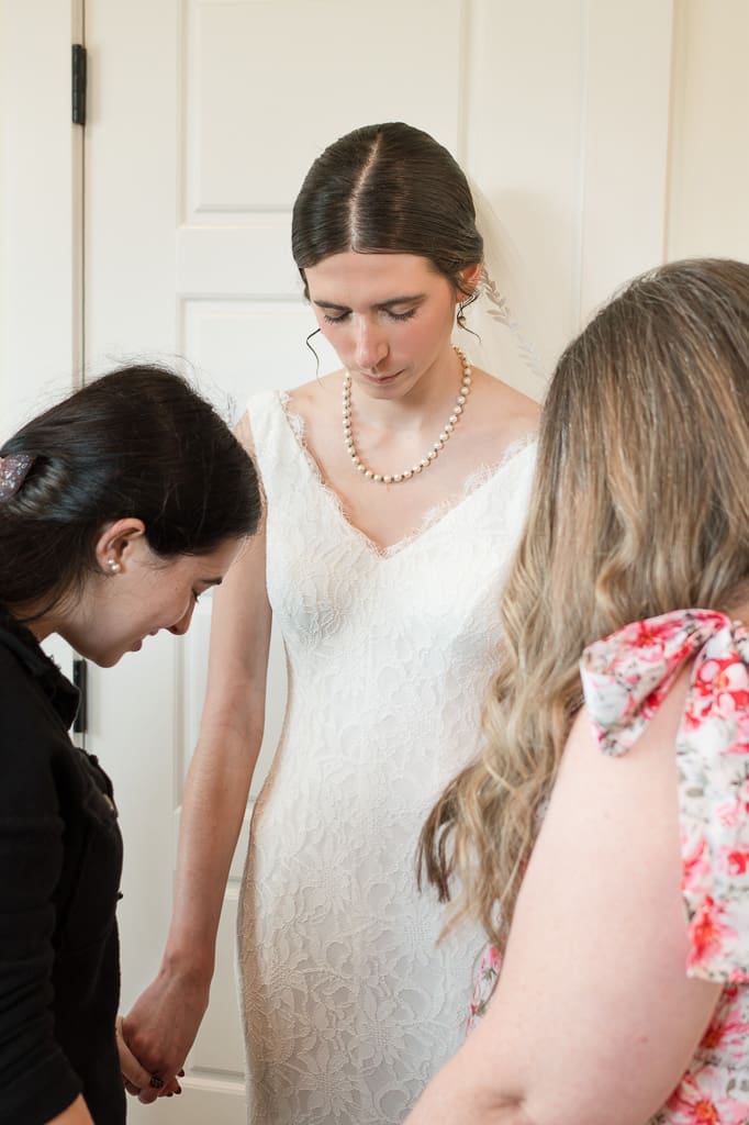 Spiritual family praying over bride before first look, South Louisiana Wedding Photographer