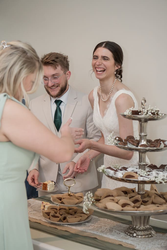 Bride & Groom serving cake to guests at reception as a married couple, South Louisiana Wedding Photographer