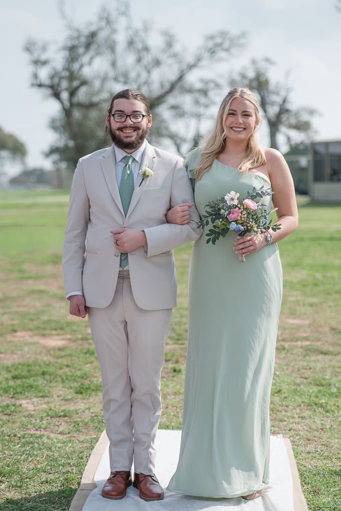 Bridesmaid and Groomsmen walking down the aisle by South Louisiana Wedding Photographer