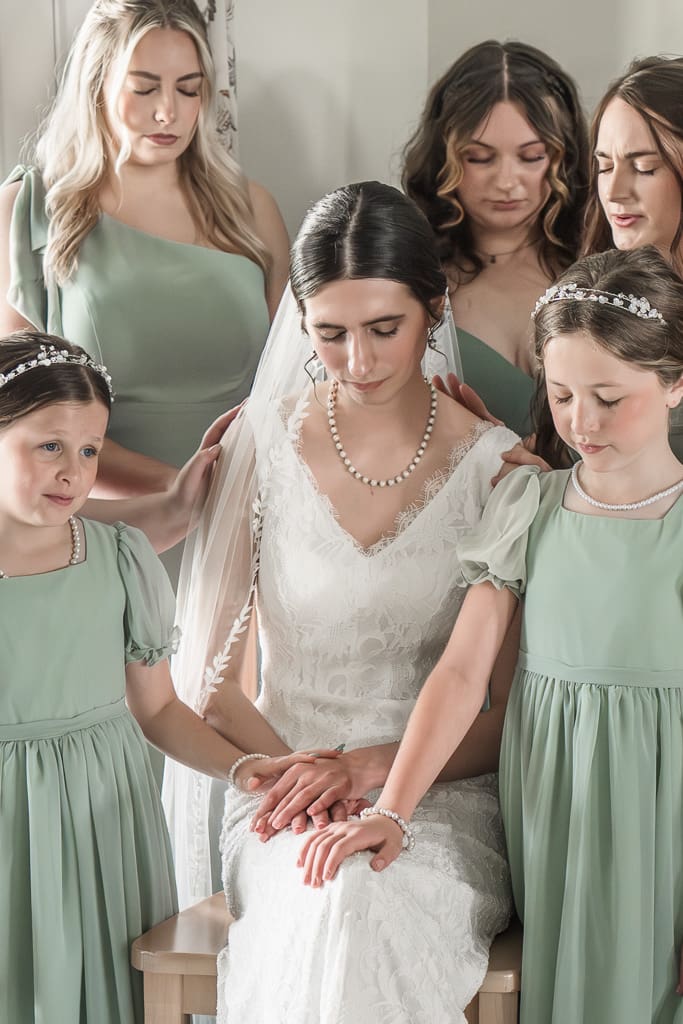 Bridesmaid's praying over bride at South Louisiana Wedding
