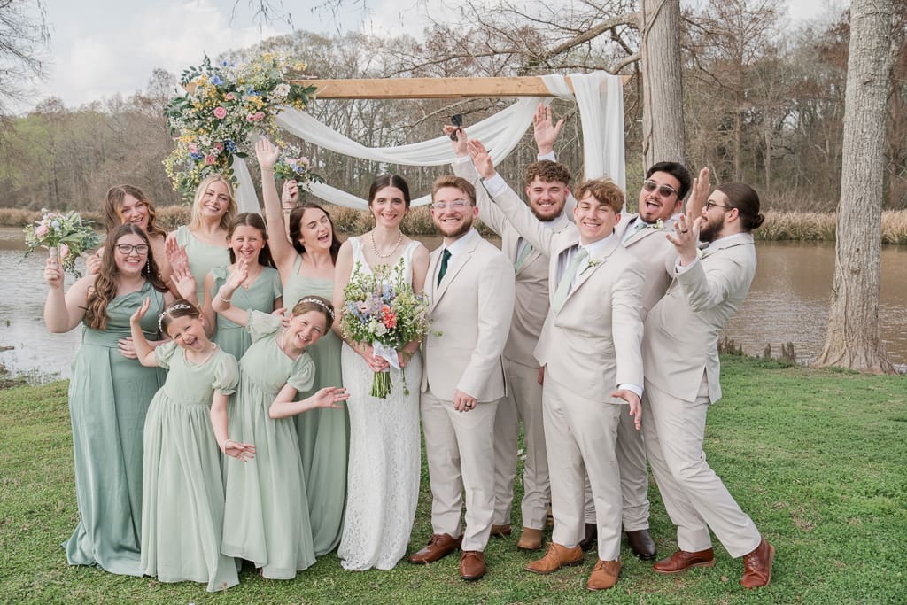 Entire wedding party celebrating after wedding ceremony on Bayou Teche, South Louisiana Wedding Photographer