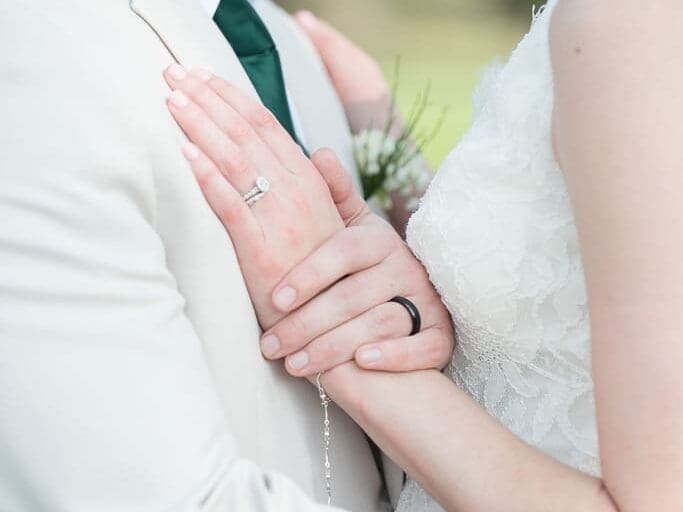 Bride and Groom choose right photographer in Louisiana for their wedding-photograph of bride and groom's rings