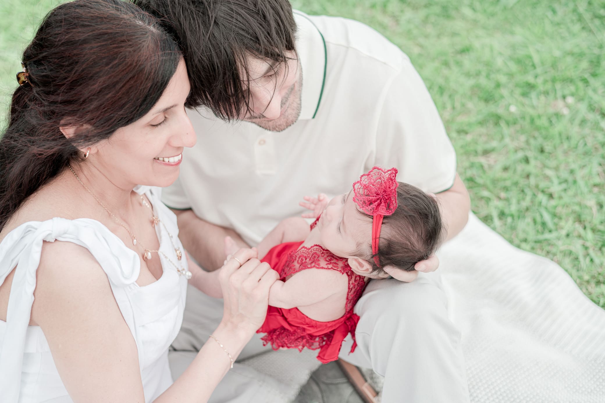 2 month old being photographed with parents by South Louisiana Newborn Photographer